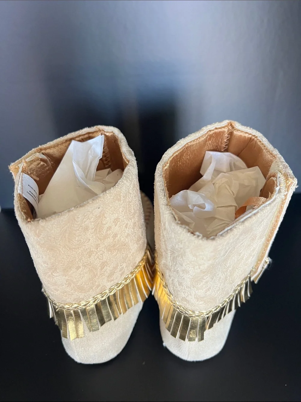 Disney Beige Moccasin Boots with Gold Fringe and Red Embroidery
